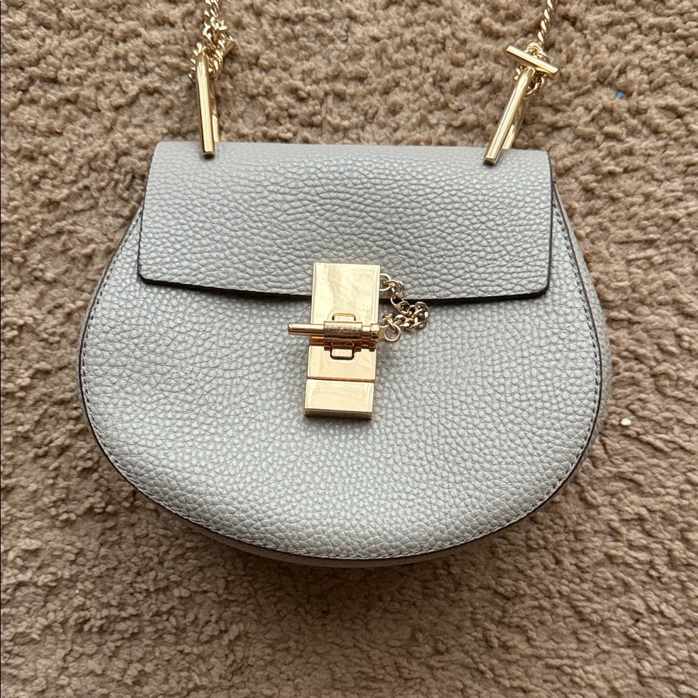 Chic Gray Crossbody Bag with Gold Accents